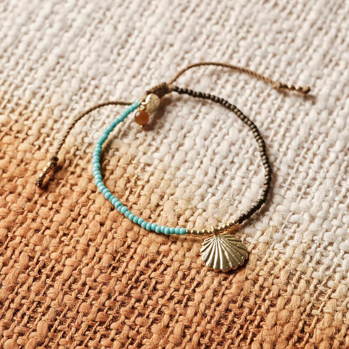 Tigerauge Armband Hoping mit Muschel - nachhaltiger handgemachter Schmuck aus Nepal